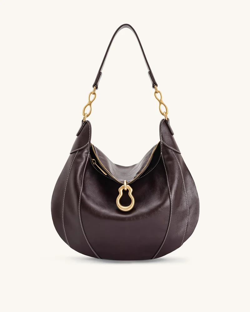 Sac à bandoulière orné d'un pendentif métallique Daria - Marron foncé