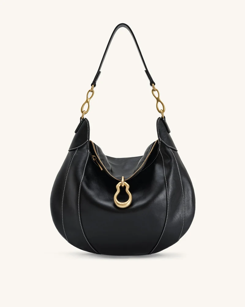 Sac à bandoulière orné d'un pendentif métallique Daria - Noir
